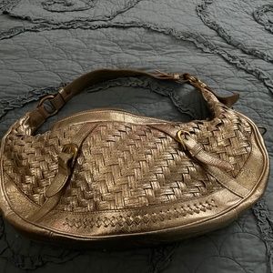 Elliott Lucca gold woven leather handbag.